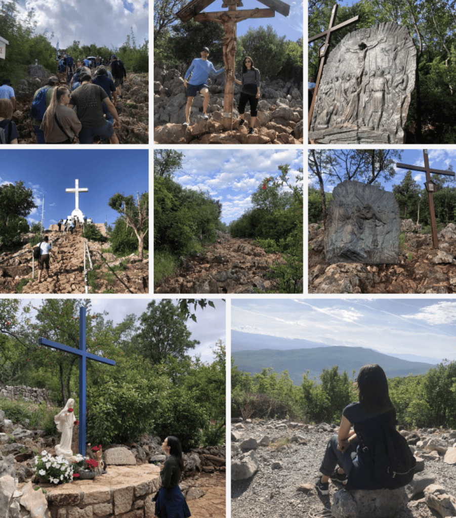 People walk a rocky path lined with crosses and plaques, symbolizing the challenges of workers’ compensation mediation in the mountains.