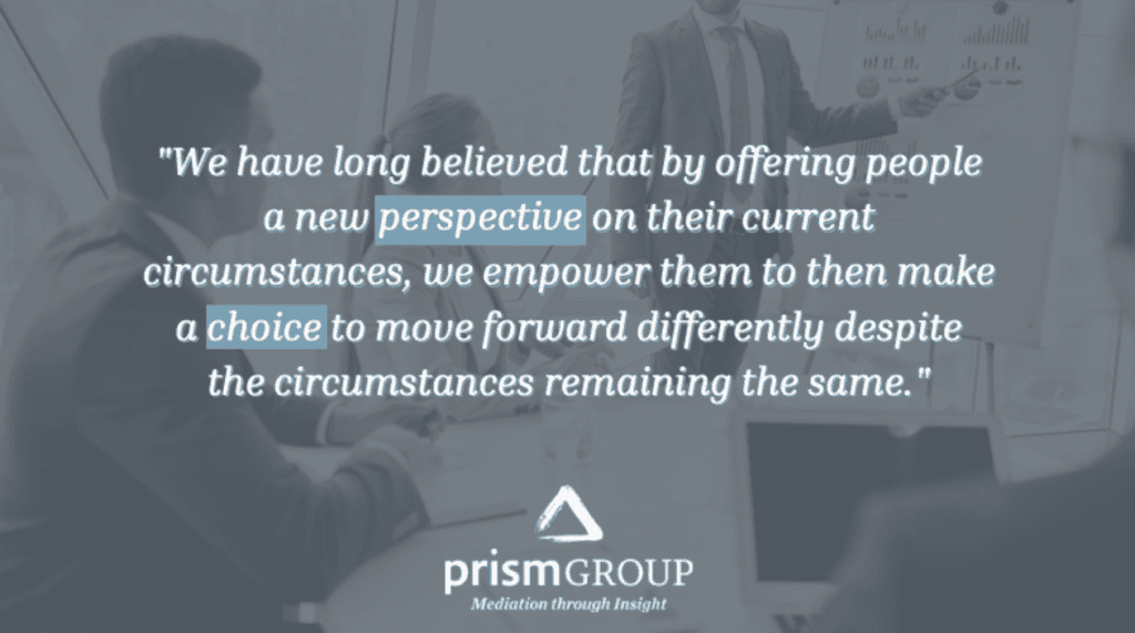 Business professionals meet in a conference room, with a quote about perspective and mediation services overlaid on the image.