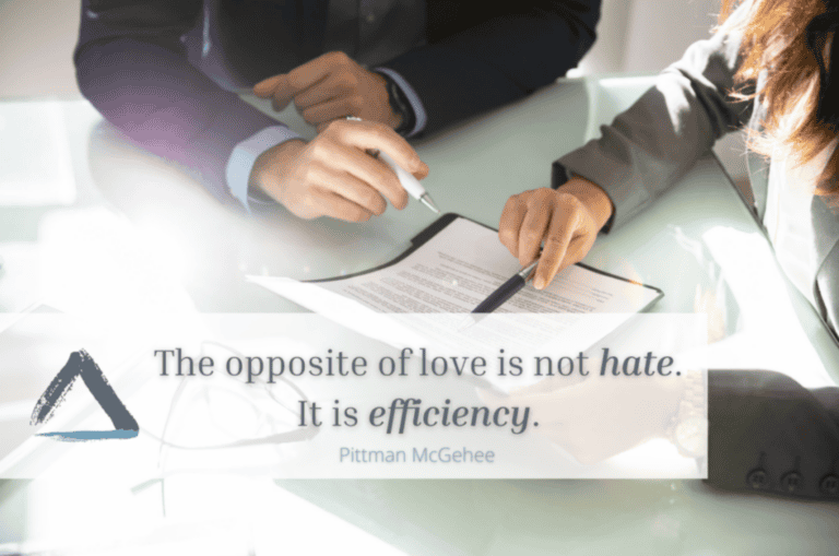 Two professionals in business attire sign paperwork, symbolizing workers’ compensation mediation beside a love and efficiency quote.