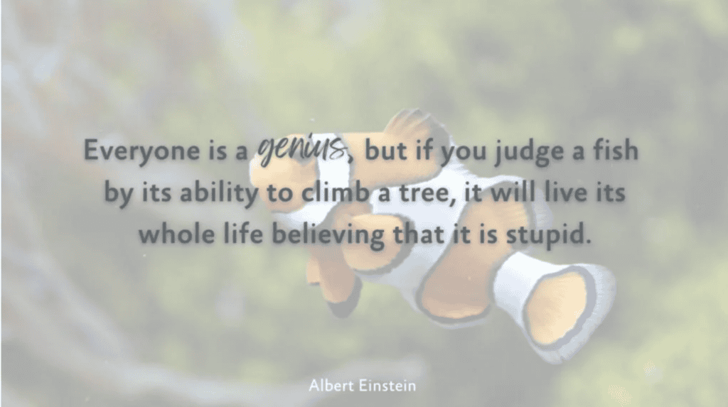 A clownfish swims by as Einstein’s quote highlights the importance of fairness, echoing ideals in workers’ compensation mediation.